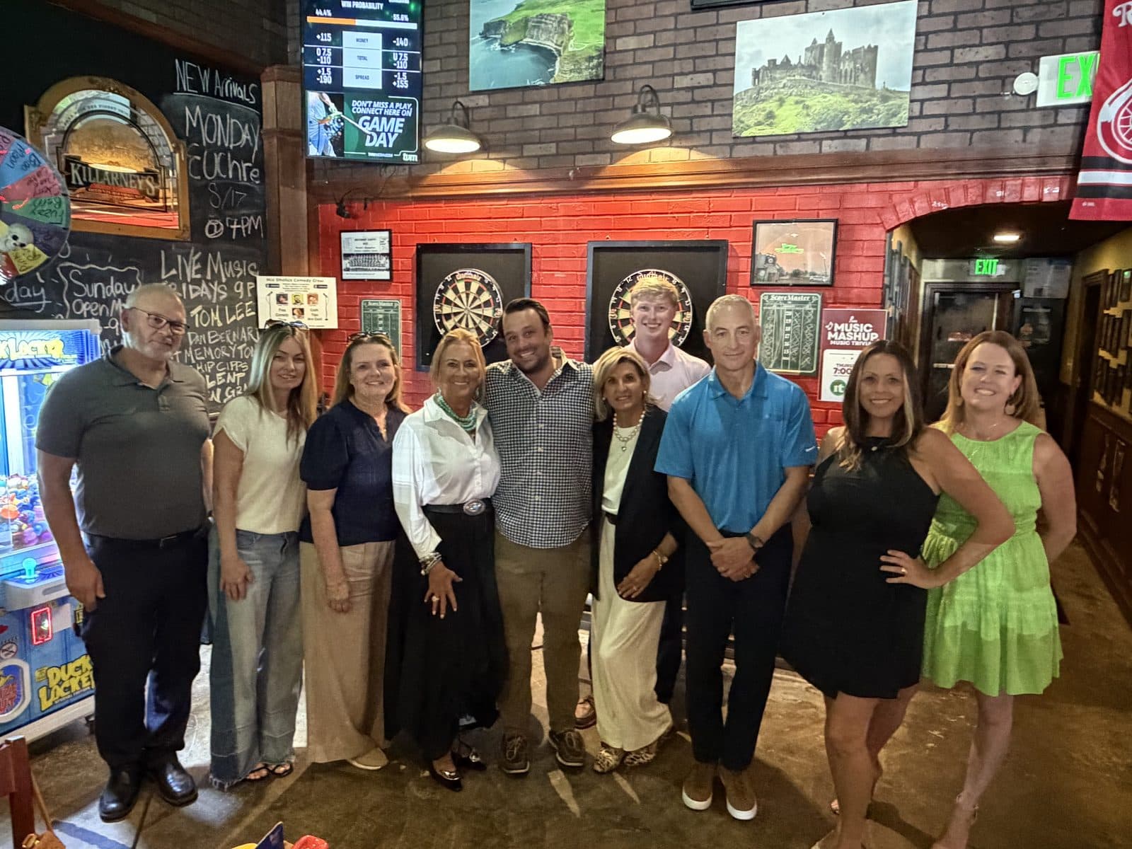 A row of Impact members together at a meetup