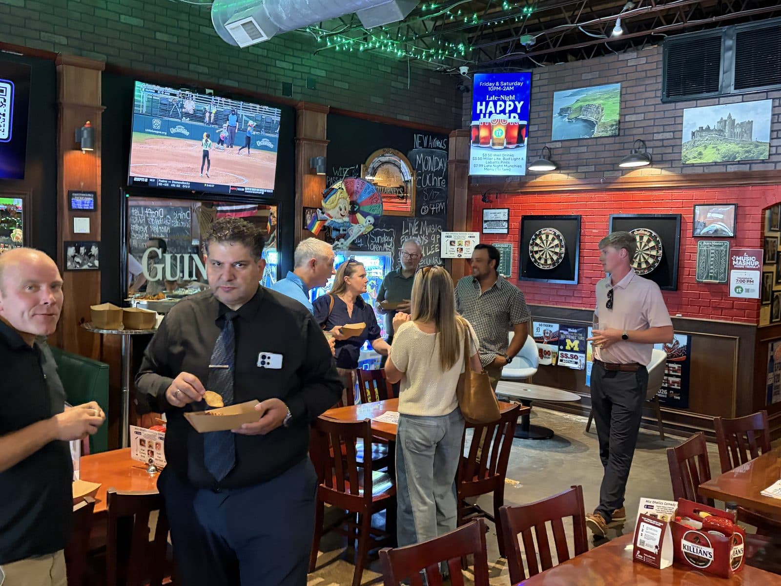 Members mingling with food and drinks