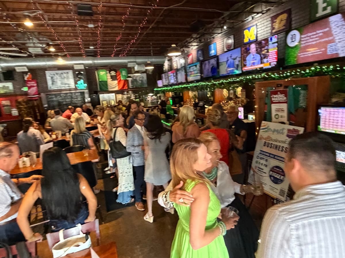 A packed bar full of members at an Impact After Hours